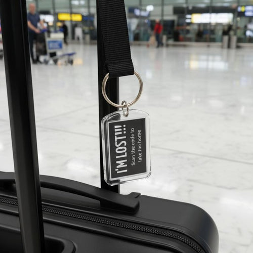 Luggage tag with 'I'M LOST!!!' message attached to a suitcase in an airport setting